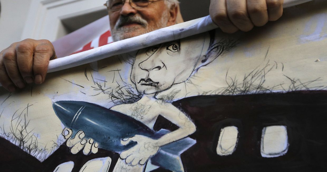 Акция протеста в Минске против российского вмешательства в Сирии