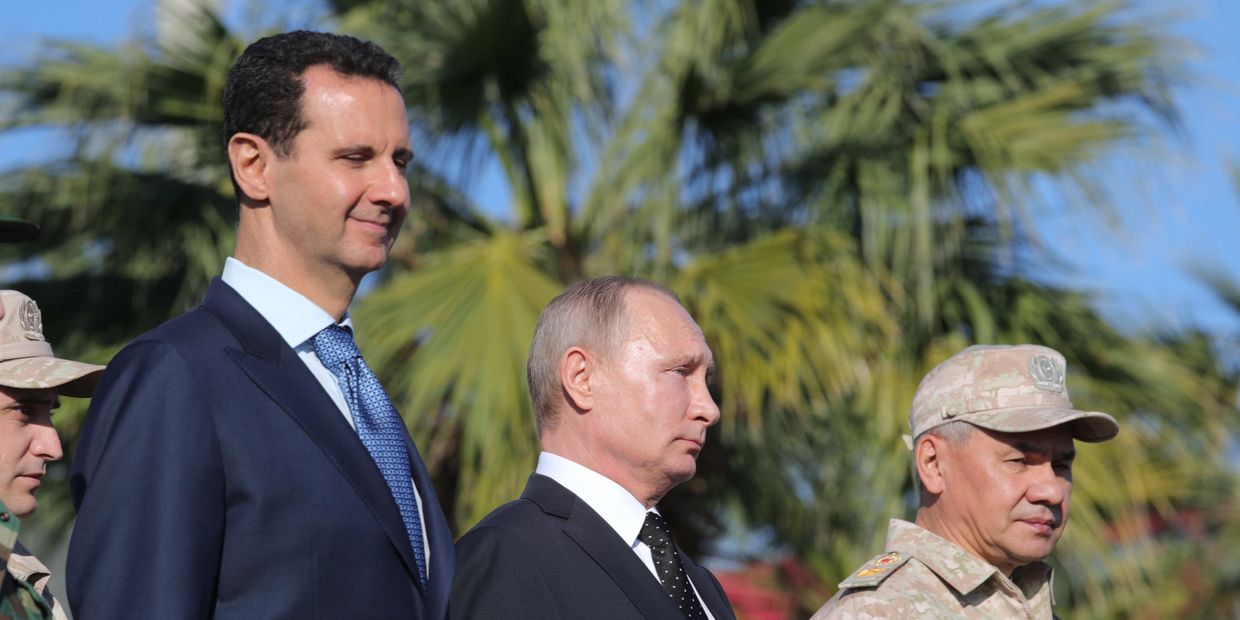 Владимир Путин, президент Сирийской Арабской Республики Башар Асад и министр обороны России Сергей Шойгу во время посещения авиабазы Хмеймим в Сирии. 11 декабря 2017
