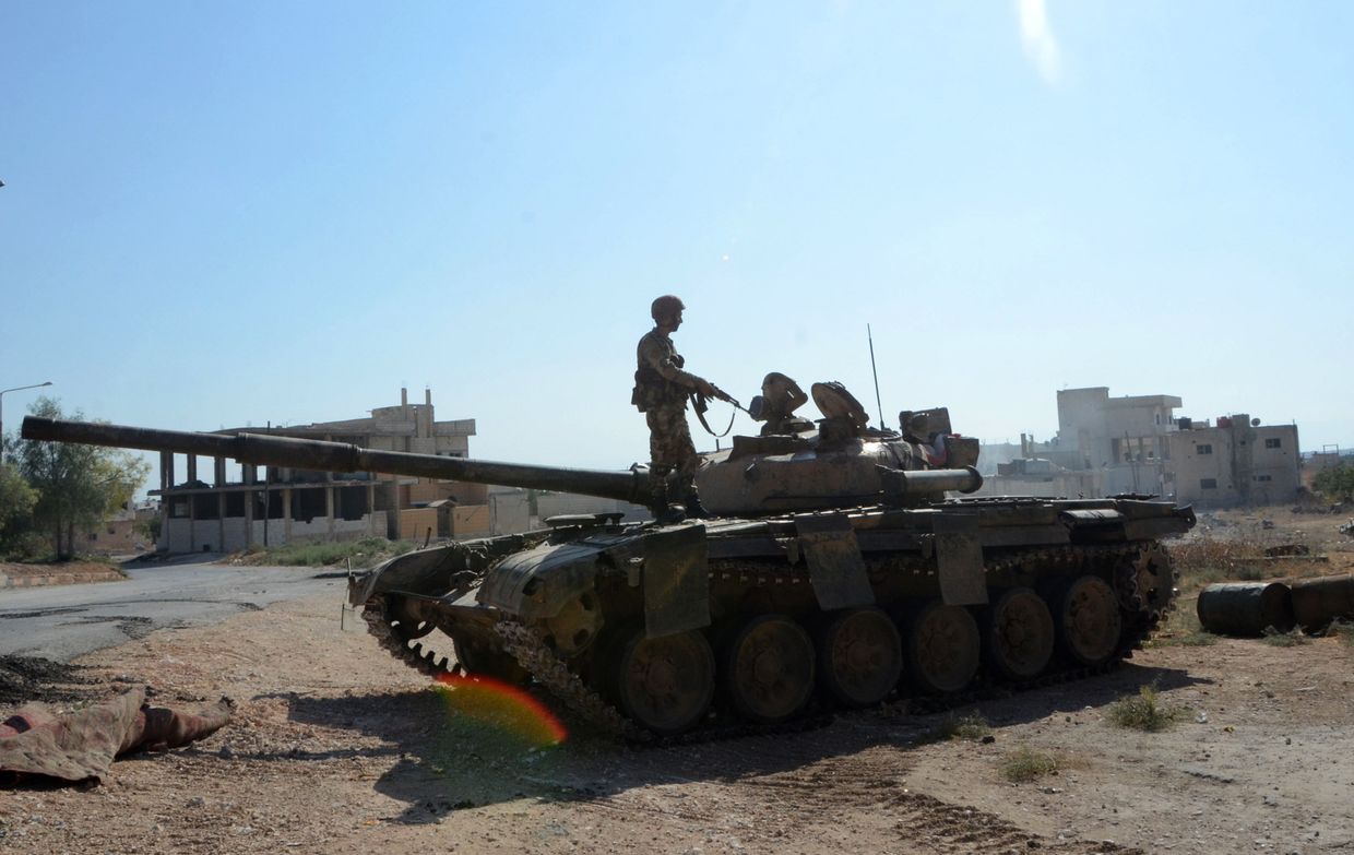 Сирийские военные в городе Хан-Шейхун Сирийские военные в городе Хан-Шейхун